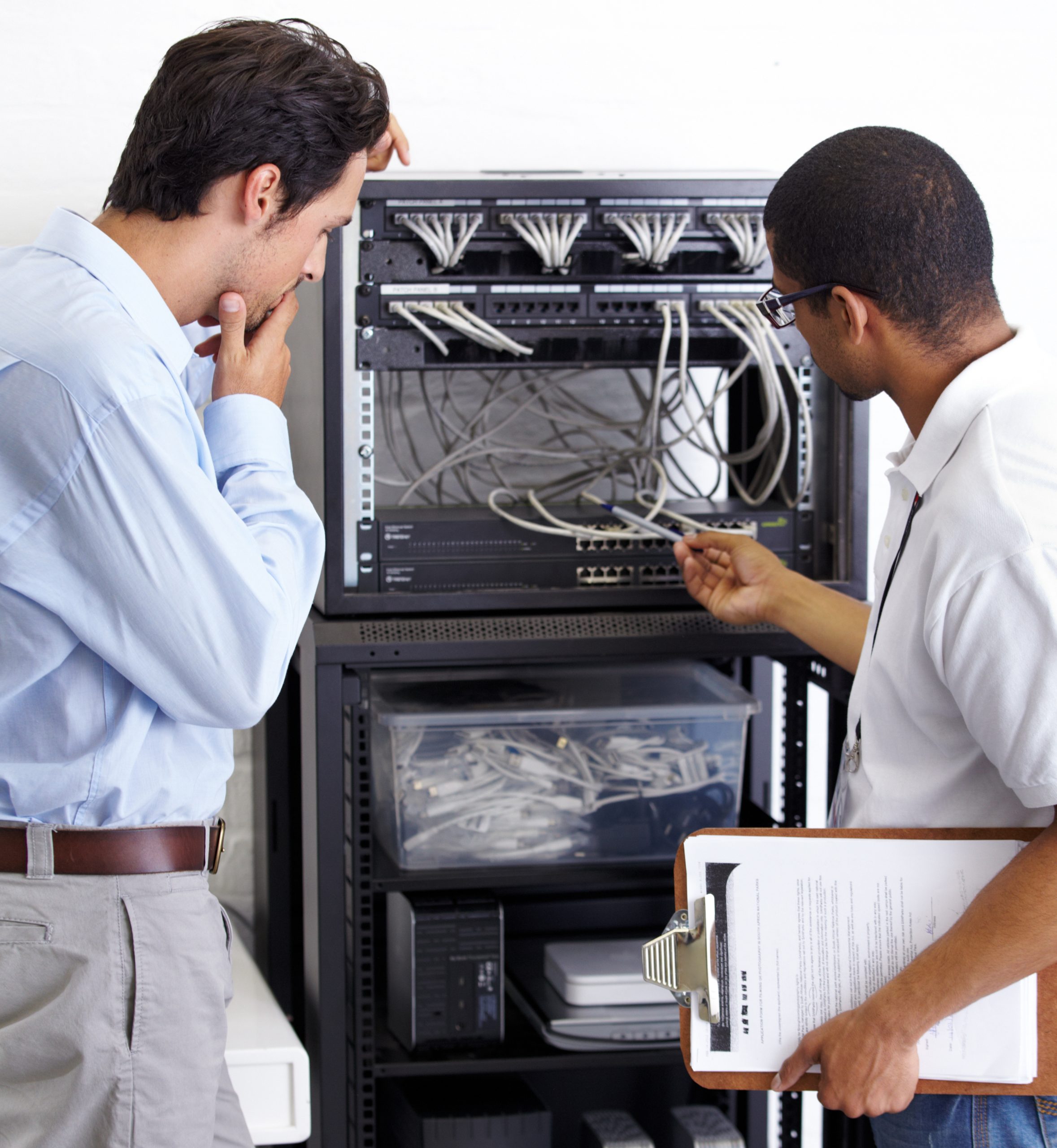 Information technology, men and wire in server room for maintenance, inspection and fixing. Cable, IT technician and fix computer for cybersecurity, networking or database repair in data center.